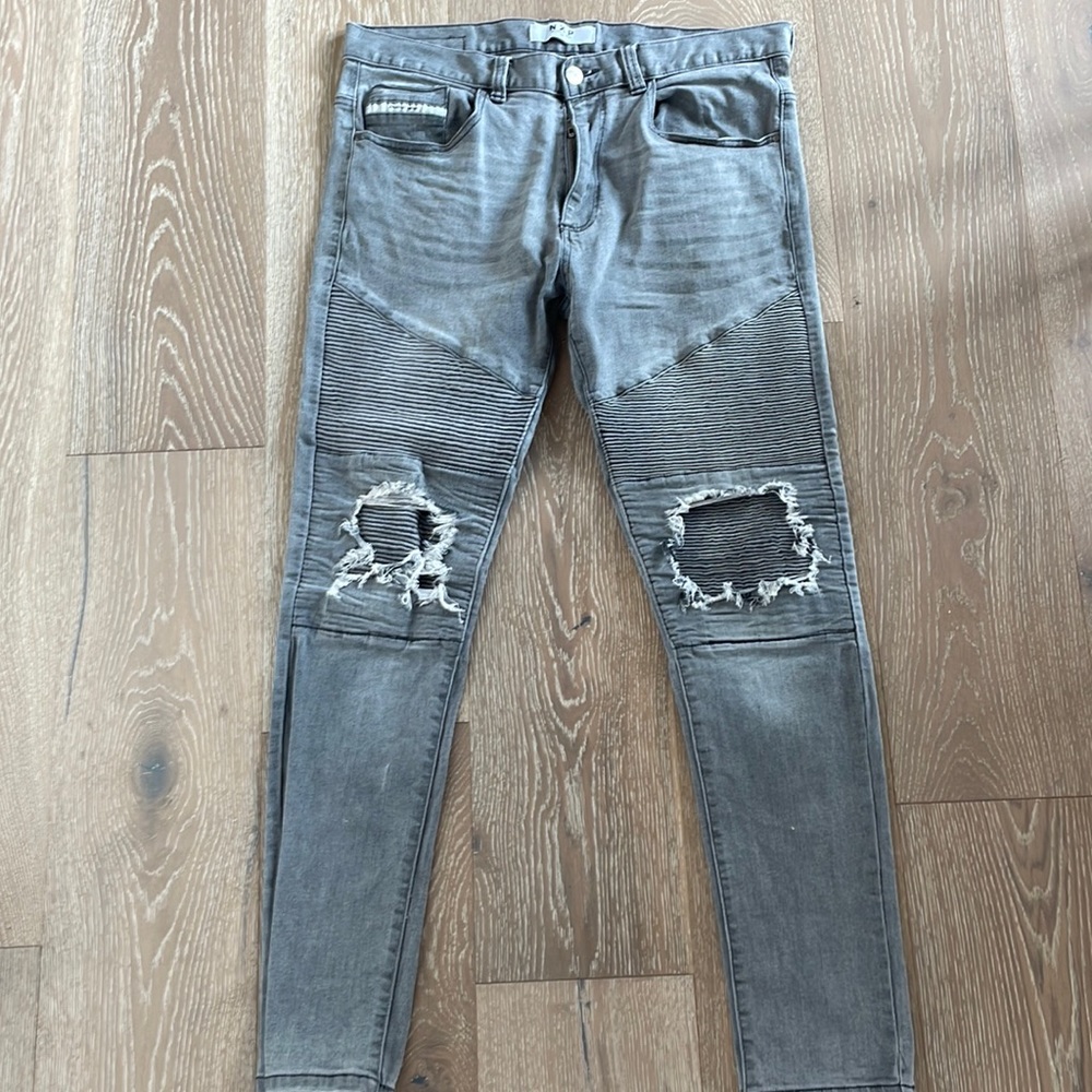 Gray NXP jeans with moto-details